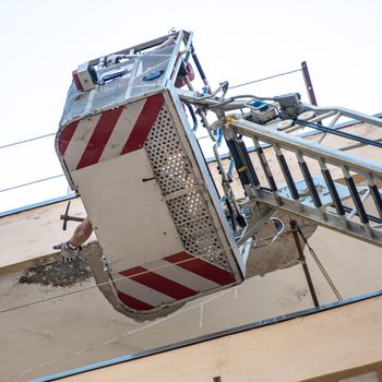 Firefighters working to put uncertainty of a cornice