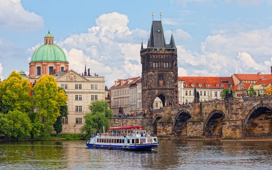 Prague, view of Karlov Bridge and tourists going on it