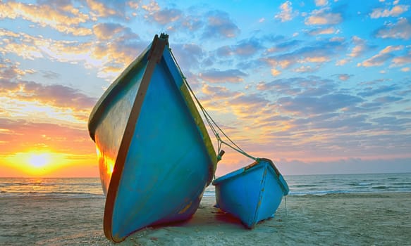 Fishing boats and sunrise on Black Sea beach