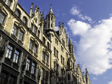 Closeup of the city hall in Munich in the evening sun and blue sky