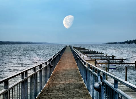 boat dock and moon at dusk