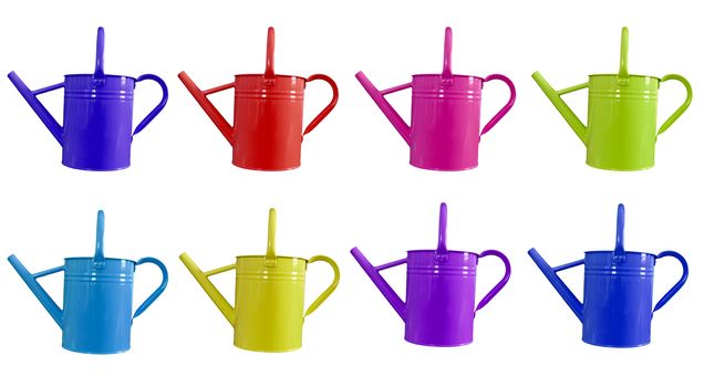 eight different colored watering cans for gardening