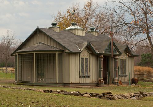 fancy hen house in autumn on overcast day