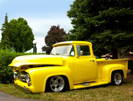 old, restored yellow pick-up truck