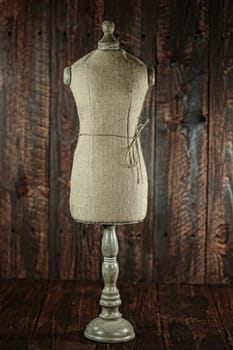 Vintage Antique Mannequin Busts on Wood Grunge Background