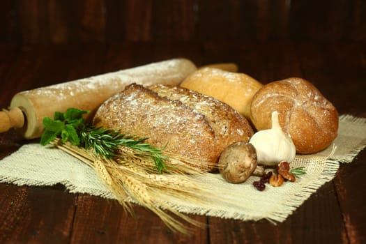 Fresh Baked Bread on Wooden Background