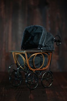 Antique Infant Baby Cradle on Grunge Wooden Background