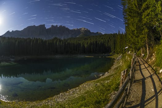 Carezza lake and Latemar with star trails, Dolomites - Italy