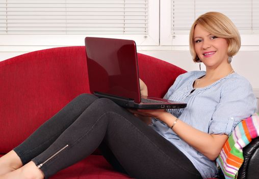 beautiful woman with laptop on bed