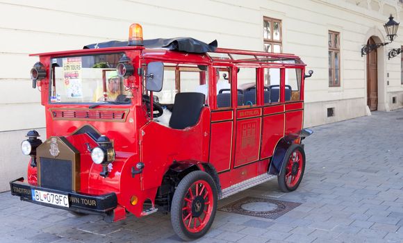 BRATISLAVA, SLOVAKIA - JULY 22: Tourists in a bus on the streets in Old Town on July 22, 2013 in Bratislava, Slovakia. Bratislava is the most populous (462,000) and most visited city in Slovakia.