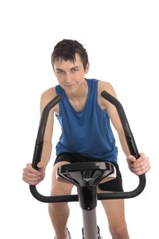 Closeup of a teenage boy using a programmable fitness and exercise bike.  White background.
