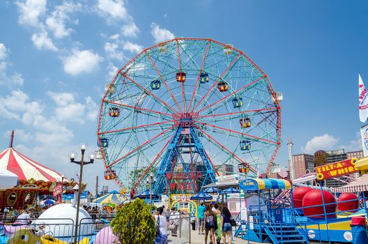 CONEY ISLAND - MAY 30: The famous Wonder Wheel in Coney Island, May 30, 2013. The Eccentric Ferris Wheel was built in 1920, it has 24 fully enclosed cars,giving a total capacity of 144 passengers  