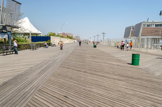 CONEY ISLAND - MAY 30: Coney Island Boardwalk seen on May 30, 2013. The 2.51 mile seaside boardwalk has drawn visitors since 1923, still hosting some of the famous amusement parks as long as the New York Aquarium