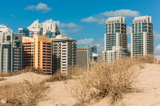 DUBAI, UAE - NOVEMBER 17: Midday heat in the desert in the background buildingsl on Nov 17, 2012 in Dubai UAE