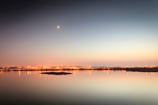 Reflections of city lights on the tejo river.