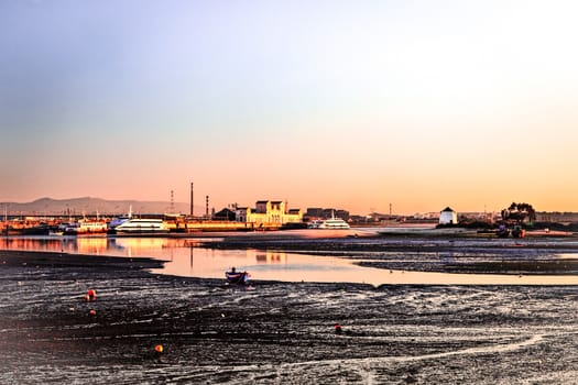 Sunset on the Tejo river with Barreiro mills in background.