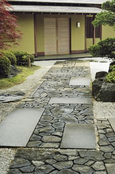 stone way to the house in traditional Japanese zen garden