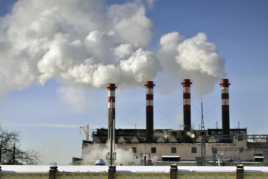 power station chimneys over blue sky background