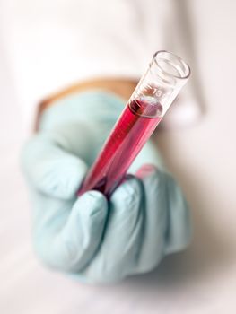 An image of test tube with a red fluid