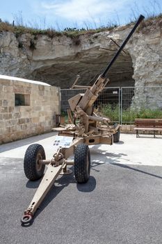 TA' QALI, MALTA - APR 20 - An old Anti Aircraft gun on display at The Malta Aviation Museum on 20 April 2013