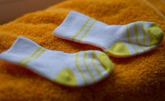 baby booties on towel