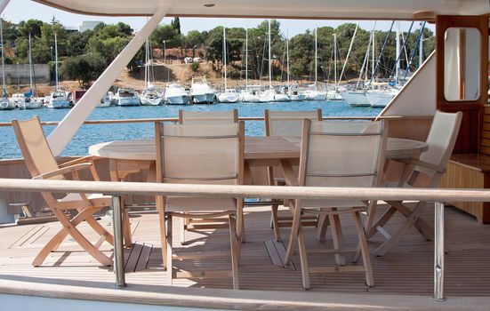 nice wooden table with chairs on main deck