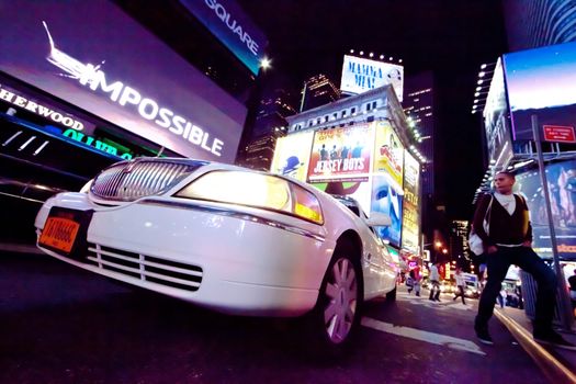 NEW YORK CITY, USA-SEPTEMBER 21: Times Square, featured with Broadway Theaters, Taxi Cabs, Luxury Limousines and animated LED signs, is a symbol of New York City and the United States. Taken in Manhattan, New York City on September 21, 2012