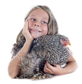 little girl and chicken in front of white background