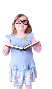 little girl reading a big book isolated on white background