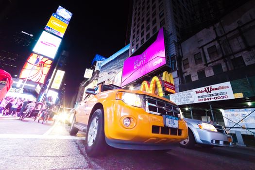 NEW YORK CITY, USA-SEPTEMBER 21: Times Square, featured with Broadway Theaters, Taxi Cabs, Luxury Limousines and animated LED signs, is a symbol of New York City and the United States. Taken in Manhattan, New York City on September 21, 2012