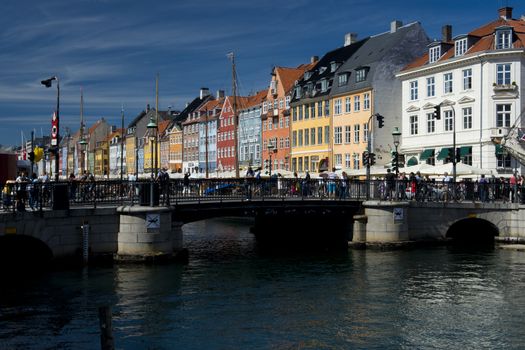 the skyline of the nyhavn, historical channel in the center of Copenhagen, Denmark, full of ancient multicolored houses