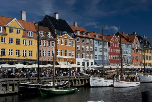 the skyline of the nyhavn, historical channel in the center of Copenhagen, Denmark, full of ancient multicolored houses