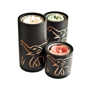 Candles with carved elephants on them - souvenir from Asia or Africa
