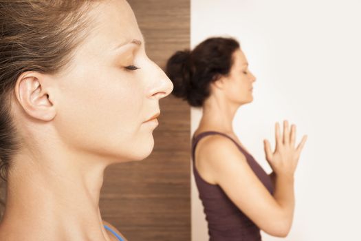 An image of some people doing yoga exercises