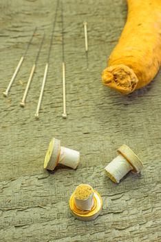 acupuncture needles, moxibustion cones and ginseng root