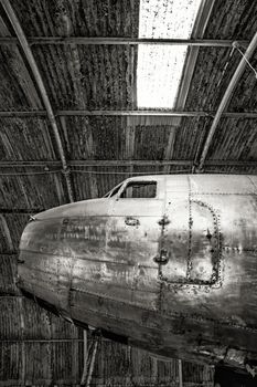 Cockpit section from an old aircraft lying in a workshop