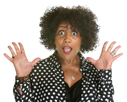 Surprised mature Black woman with hands up