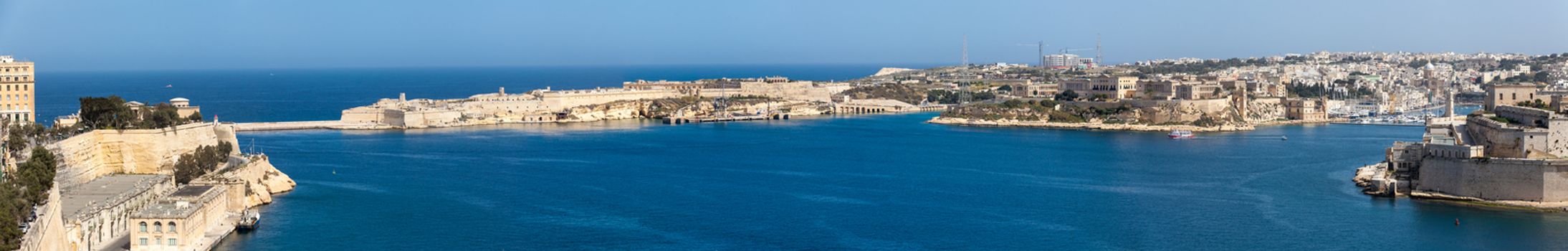 A view of the Grand Harbour in Malta, as seen from Upper Barrakka Gardens.  Left to Right: Lower Barrakka Gardens, harbour entrance breakwater, Fort Ricasoli, Bighi, Kalkara Creek, Fort St. Angelo