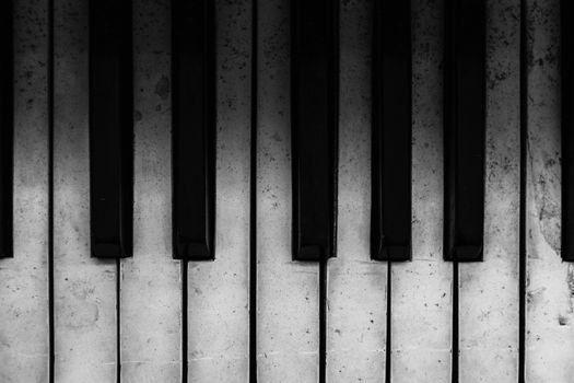 Detail shot of an old piano's keyboard keys