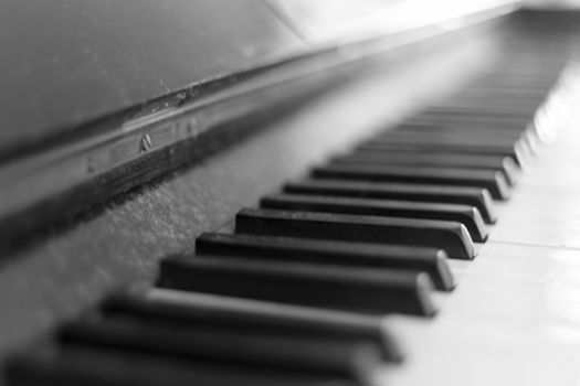 Detail shot of an old piano's keyboard keys