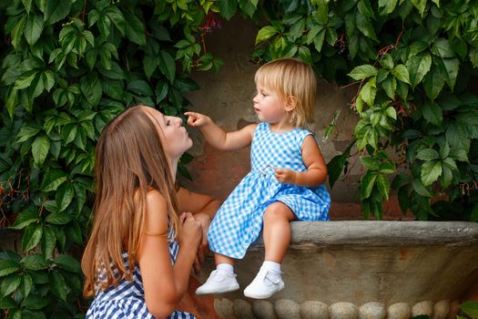 Family, mother and daughter look at each other and smile