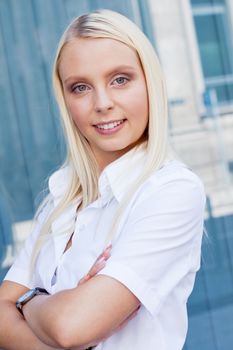 attractive young successful smiling business woman standing outdoor in summer 
