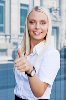 attractive young successful smiling business woman standing outdoor in summer 