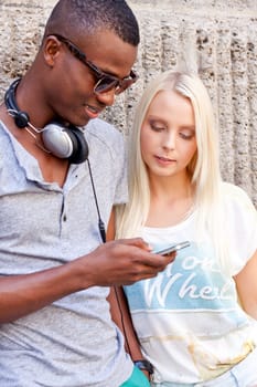 happy young couple have fun in the city summertime outdoor smiling lifestyle