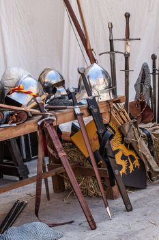 Table with various pieces of medieval armour