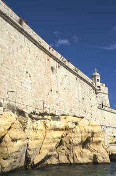 The towering walls of Fort St. Angelo in Vittoriosa, Malta