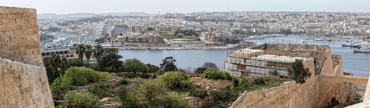 Ta' Xbiex point, as seen from Hastings Gardens in Valletta.  Restoration works on the Valletta bastions being carried out in the foreground