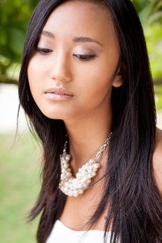 attractive young asian woman beauty portrait outdoor summer green background