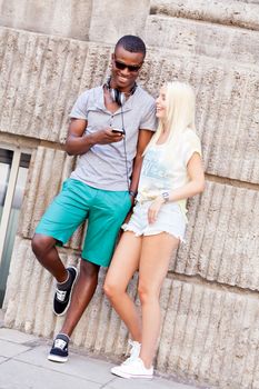 happy young couple have fun in the city summertime outdoor smiling lifestyle