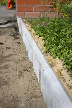 Concrete curbs used in the repair of the footpath